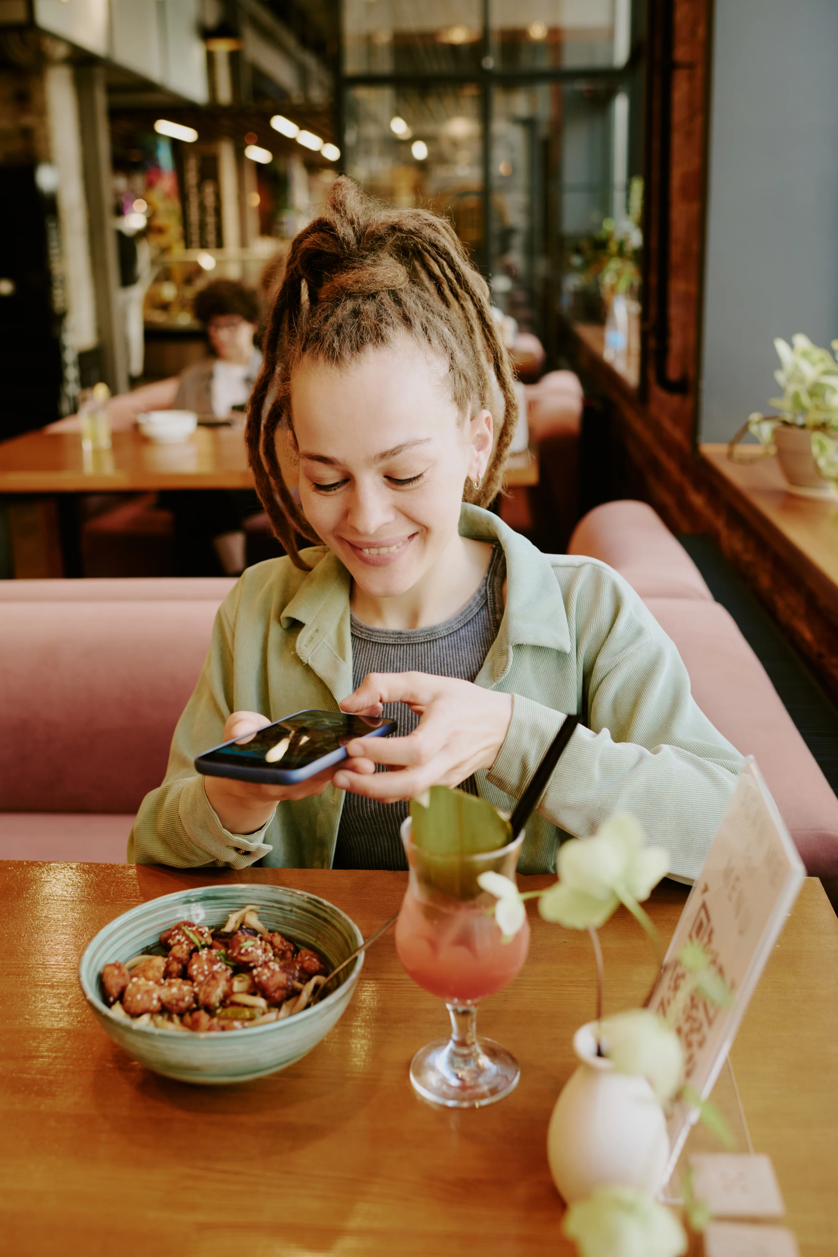 a lady snapping her meal