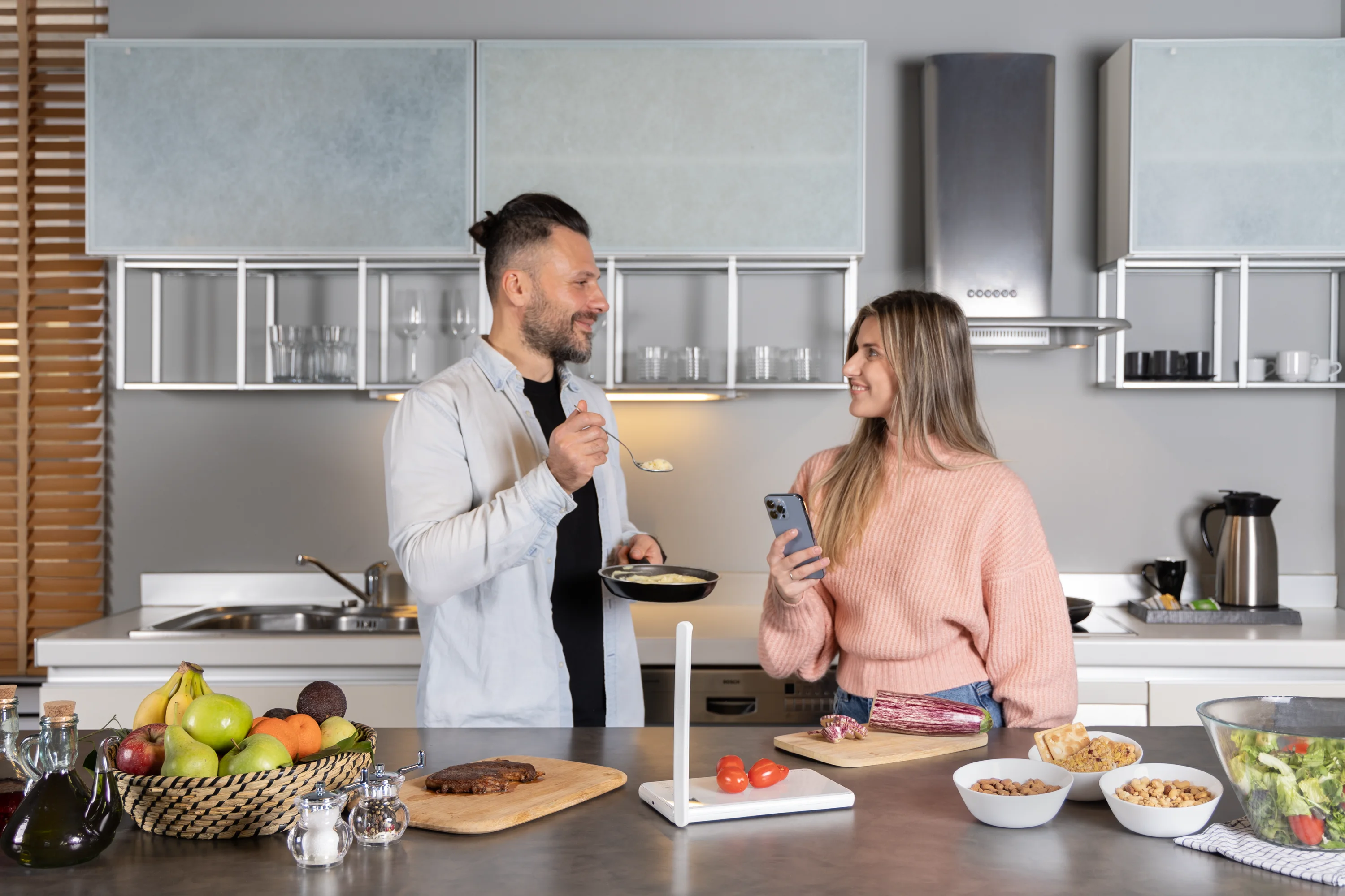two persons in the kitchen using qalzy